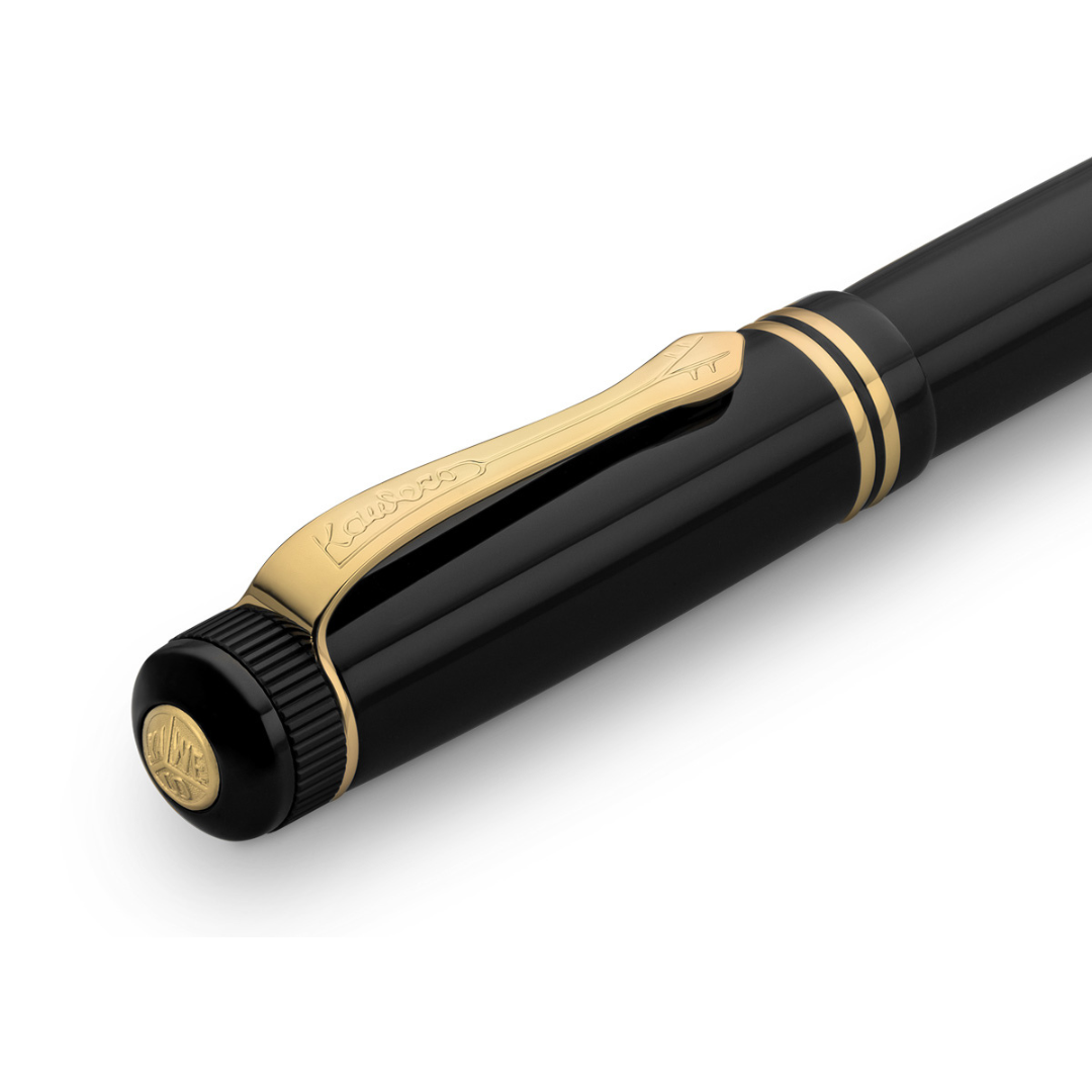 Kaweco DIA2 Ballpoint Pen - Black with Gold Trim — writing at an angle
