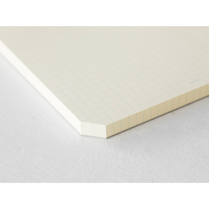 MD Notebook Paper Pad A5 - Grid — in use