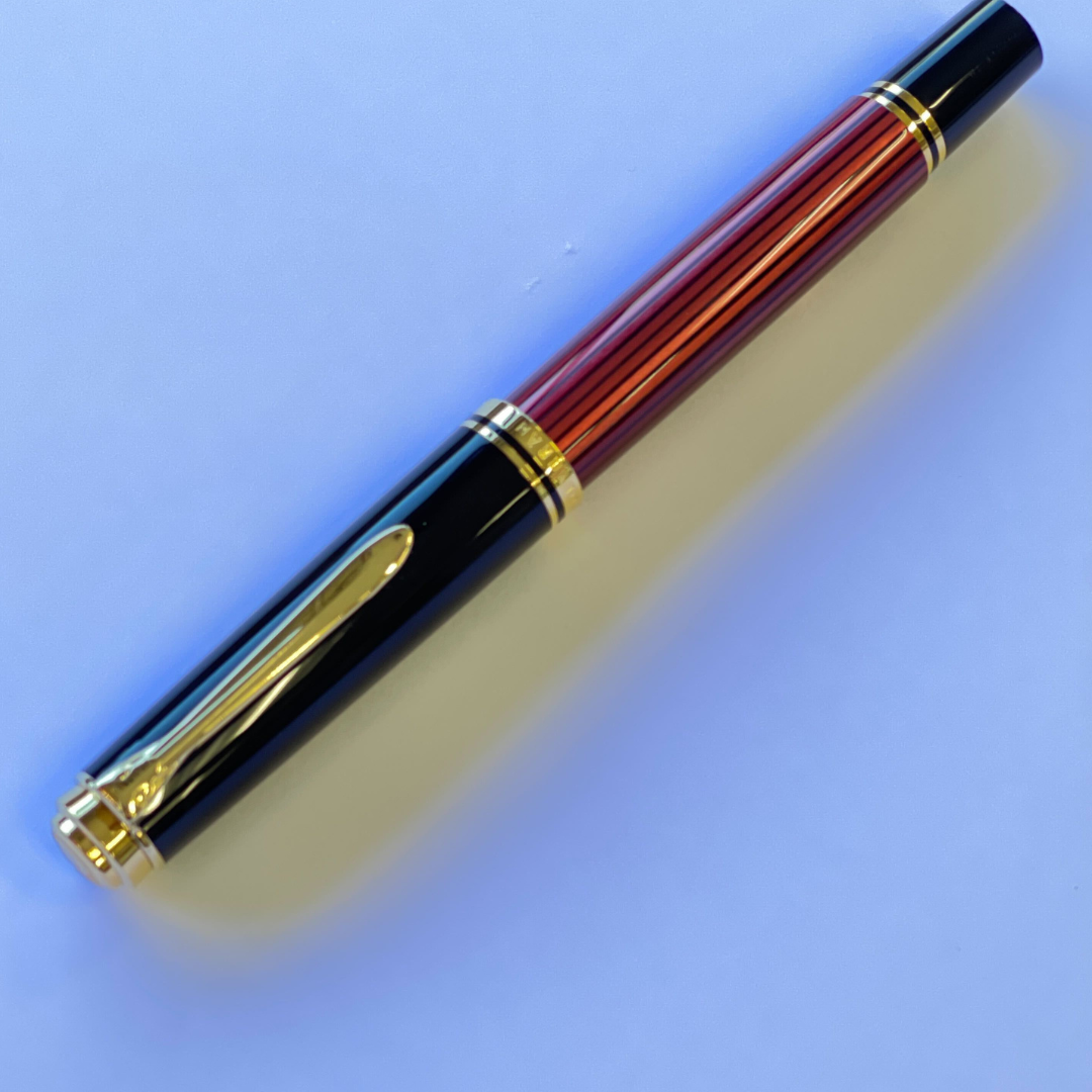 Pelikan Souveran M600 Fountain Pen - Black &amp; Red with Gold Trim (14K Gold) [Pre-Order] — flat lay