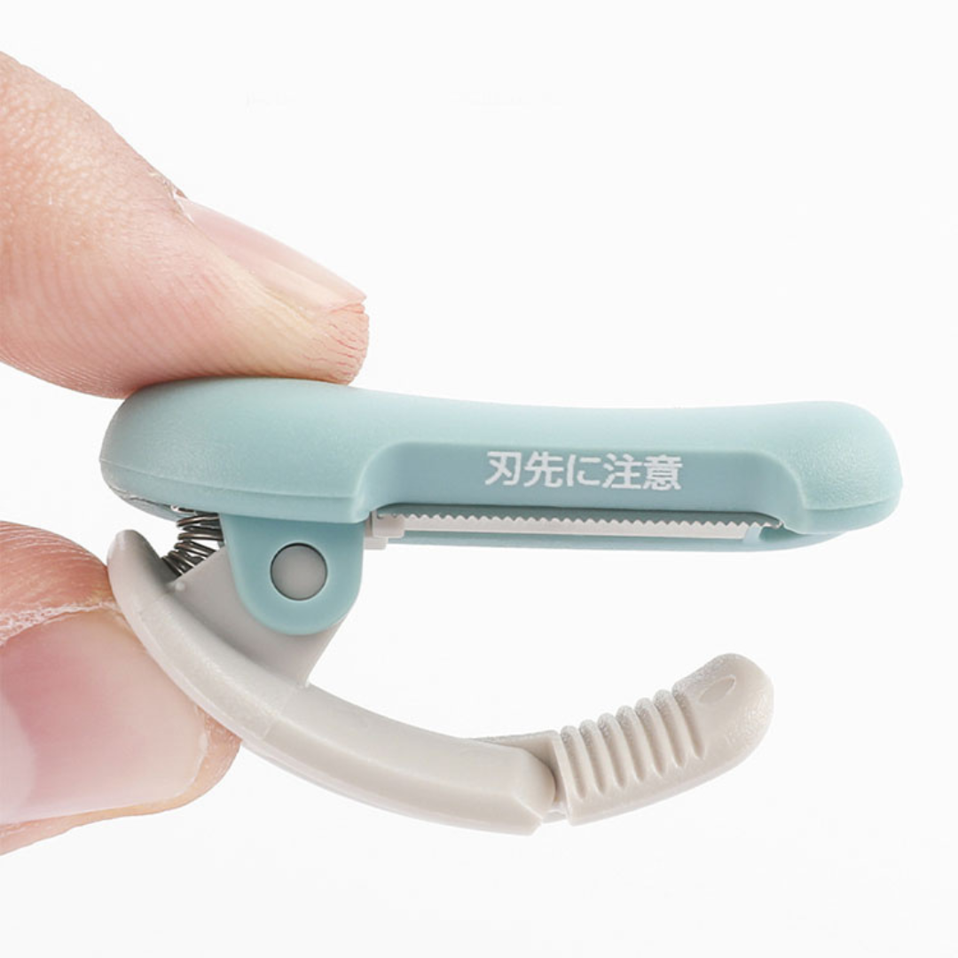 (DC) Kokuyo Me Clip-Type Tape Cutter (10-15mm) - Shell Pink — applied on surface