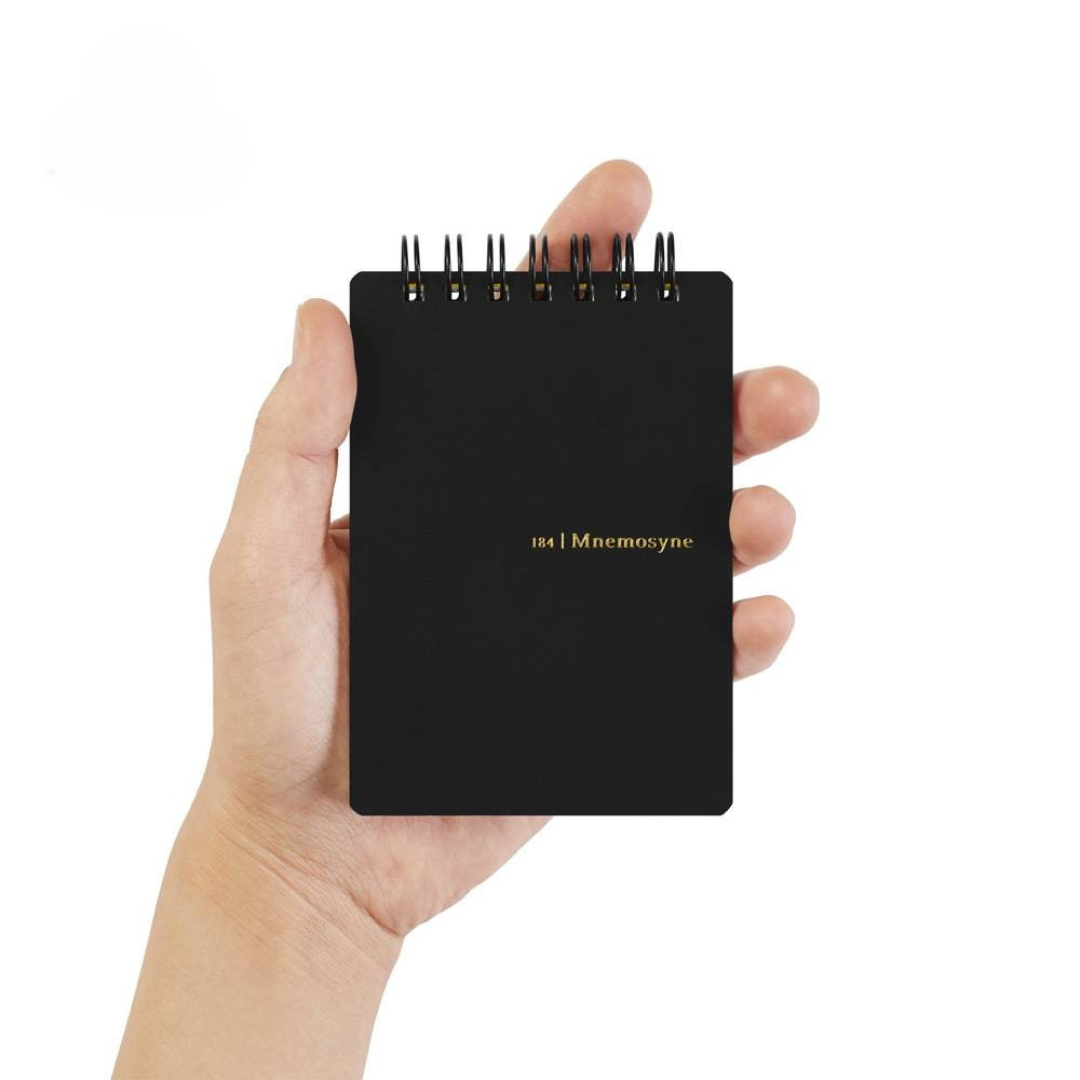 Maruman Mnemosyne A7 Twin Ring Memo Pad - Graph (Black) — in use