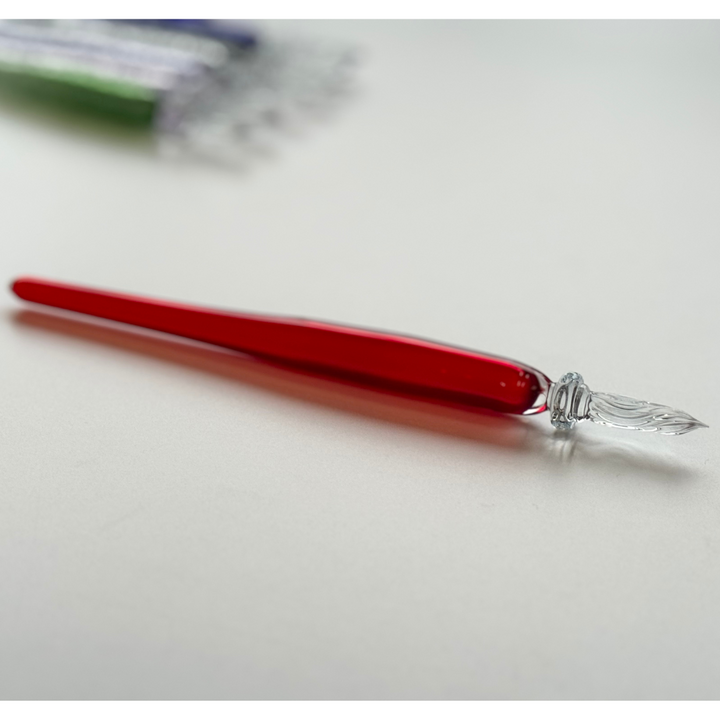 Matsubokkuri Red Glass Fountain Pen - Cherry — writing at an angle