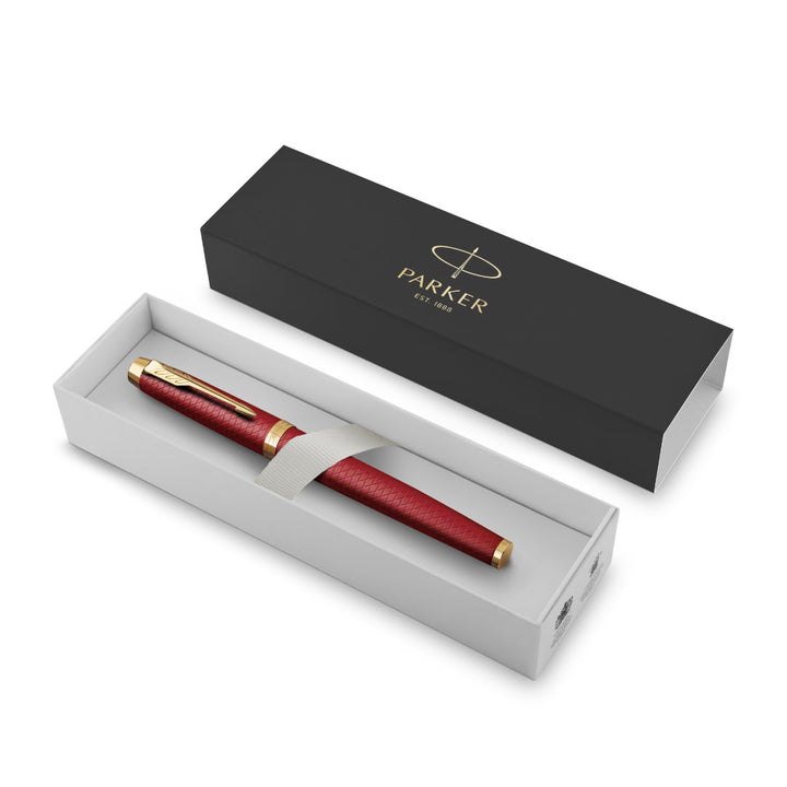 Parker IM Premium Fountain Pen - Red with Gold Trims — writing at an angle