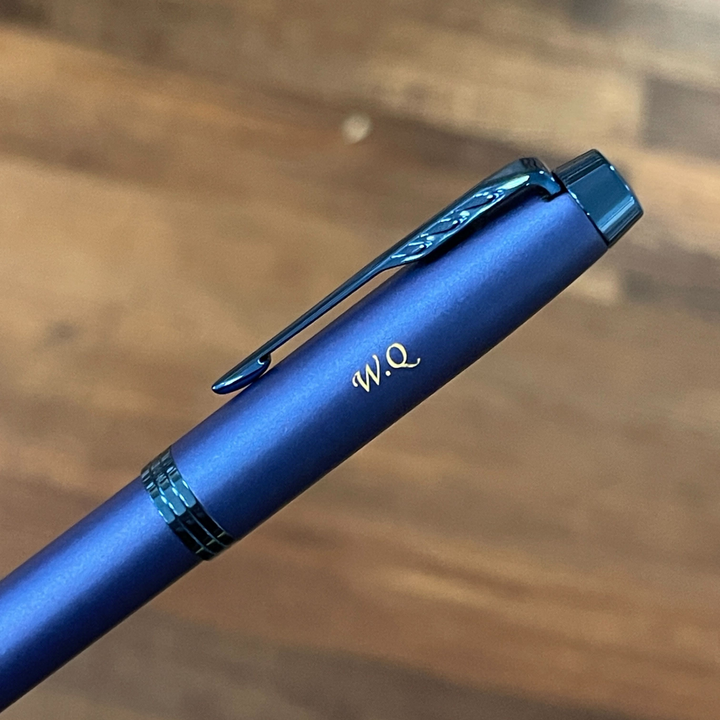 Parker IM Monochrome Blue Rollerball Pen with Leather Key Hook Set — in use