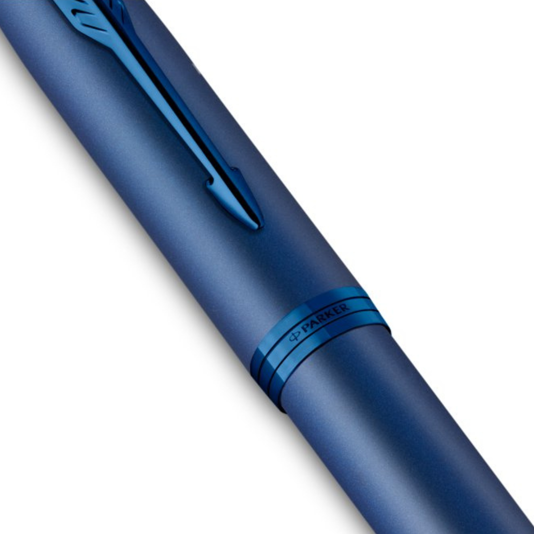 Parker IM Monochrome Blue Rollerball Pen with Leather Key Hook Set — flat lay