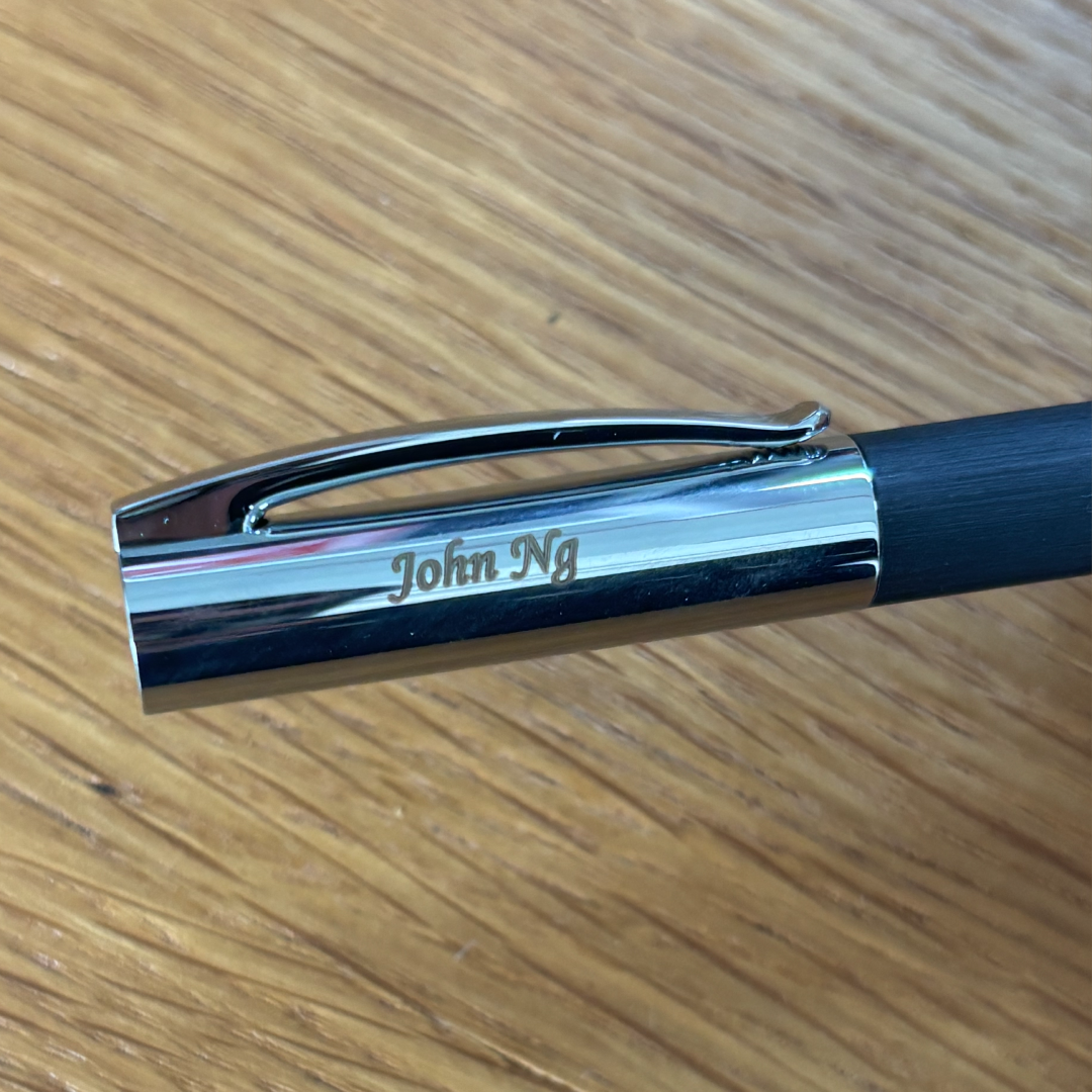Personalised name engraving on Faber-Castell Ambition Resin Ballpoint Pen Black Promo Set With Notebook at Cityluxe WorkRoom