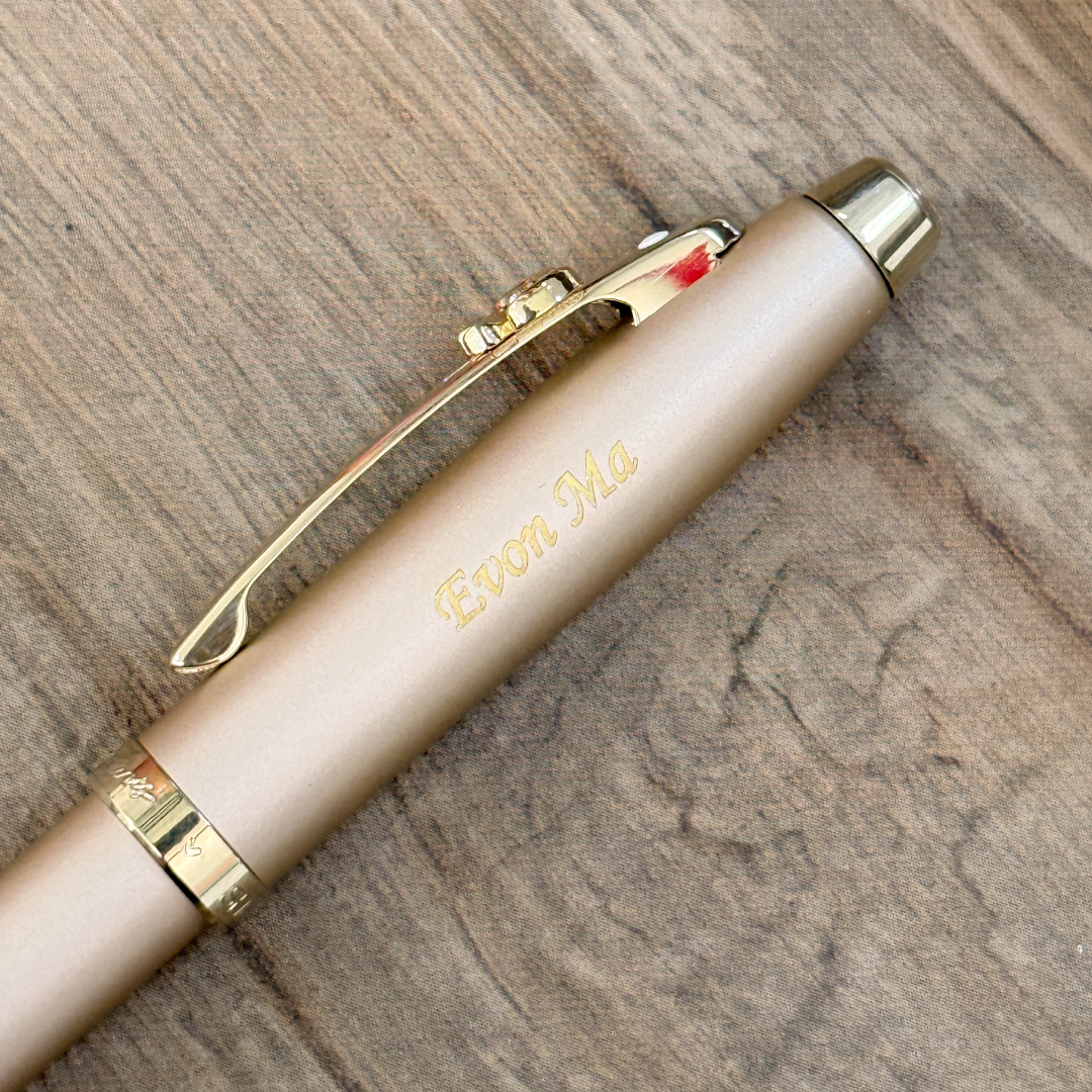 Personalised name engraving on Sheaffer 100 Emily in Paris 9377 Champagne Gold Rollerball Pen with Champagne Gold Trims and Bow-Shaped Clip Emblem at Cityluxe WorkRoom