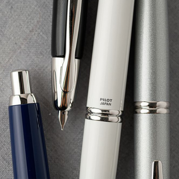 Pilot Capless Fountain Pen - Black with 18K Gold Rhodium-plated Nib — writing at an angle