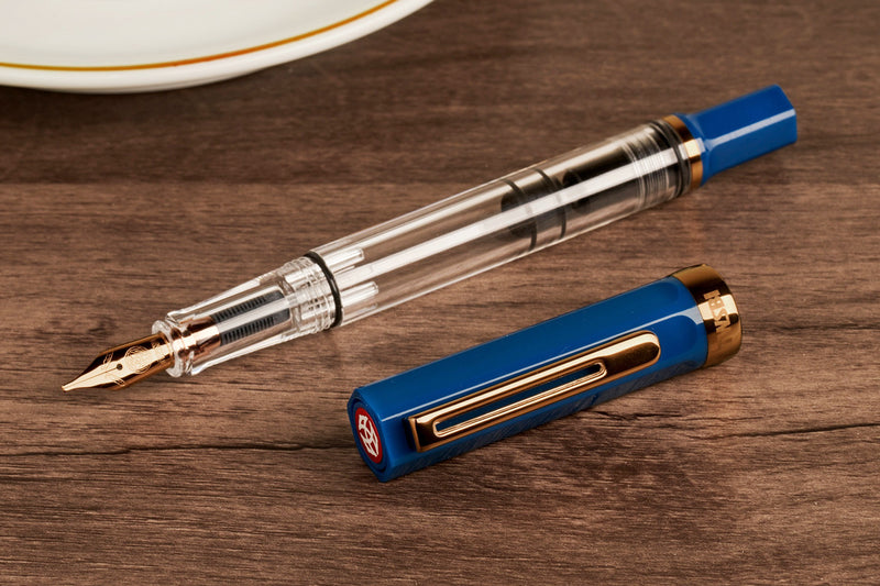 TWSBI ECO Fountain Pen - Indigo Blue with Bronze Trim — flat lay