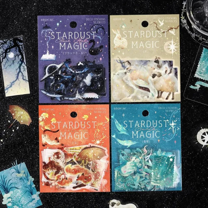 BGM Foil Stamping Clear Seal – Stardust Magic series featuring multiple PET sticker sets inspired by celestial themes, including Venus, Saturn, and other planets. Each set includes 30 sheets with 10 foil-accented space-themed designs per sheet, displayed in colorful packaging with shimmering cosmic motifs.