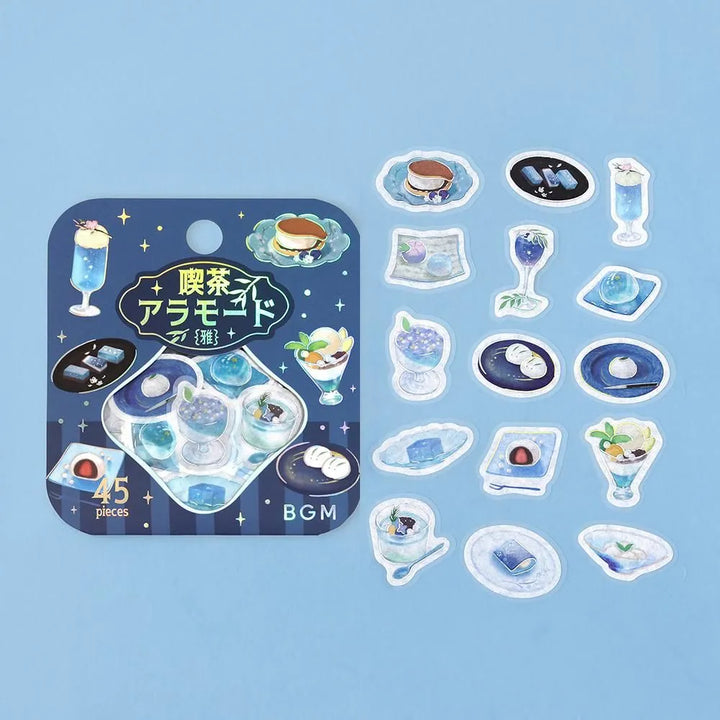 Sheet of blue-themed café flake stickers showing petite plates, parfaits, jelly desserts and drinks with shimmering foil highlights.