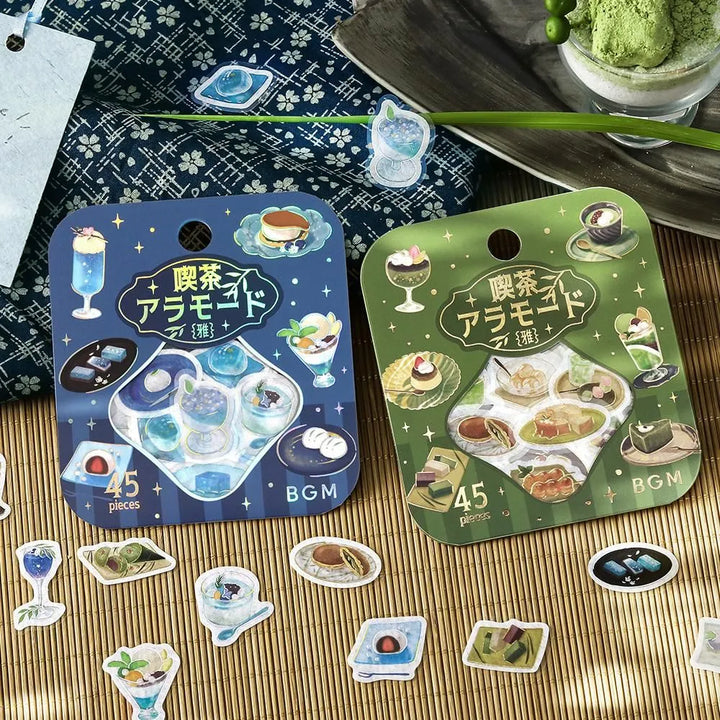 BGM Café Ala Mode Miyabi foil flake stickers in blue and green sets, featuring illustrated café desserts and drinks with metallic accents on washi paper.