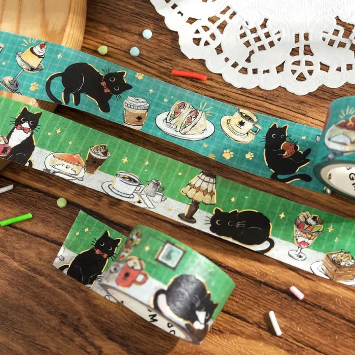 BGM Foil Stamping Masking Tape – Black Cat Café: Café Stroll featuring black cats with desserts, coffee, and foil paw prints on a 20mm washi tape roll.