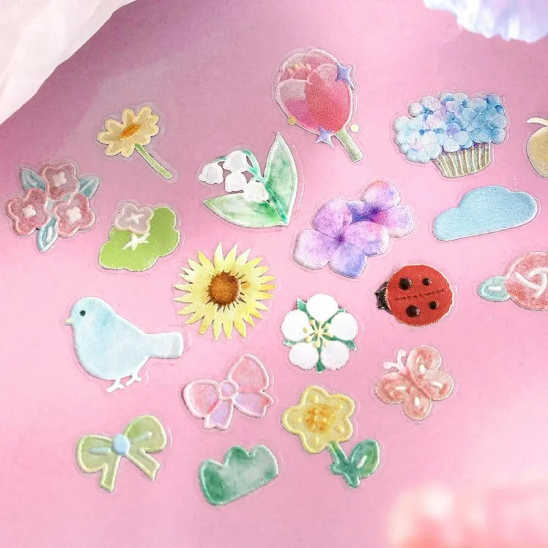 BGM Seat Seal – Bloom with one PET sticker sheet featuring delicate flowers, birds, bows, and gentle accents in pastel tones. Stickers have a glossy embossed finish.
