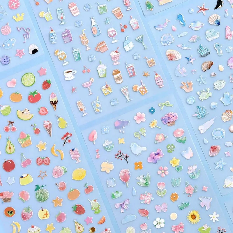 BGM Seat Seal – Bloom with one PET sticker sheet featuring delicate flowers, birds, bows, and gentle accents in pastel tones. Stickers have a glossy embossed finish.
