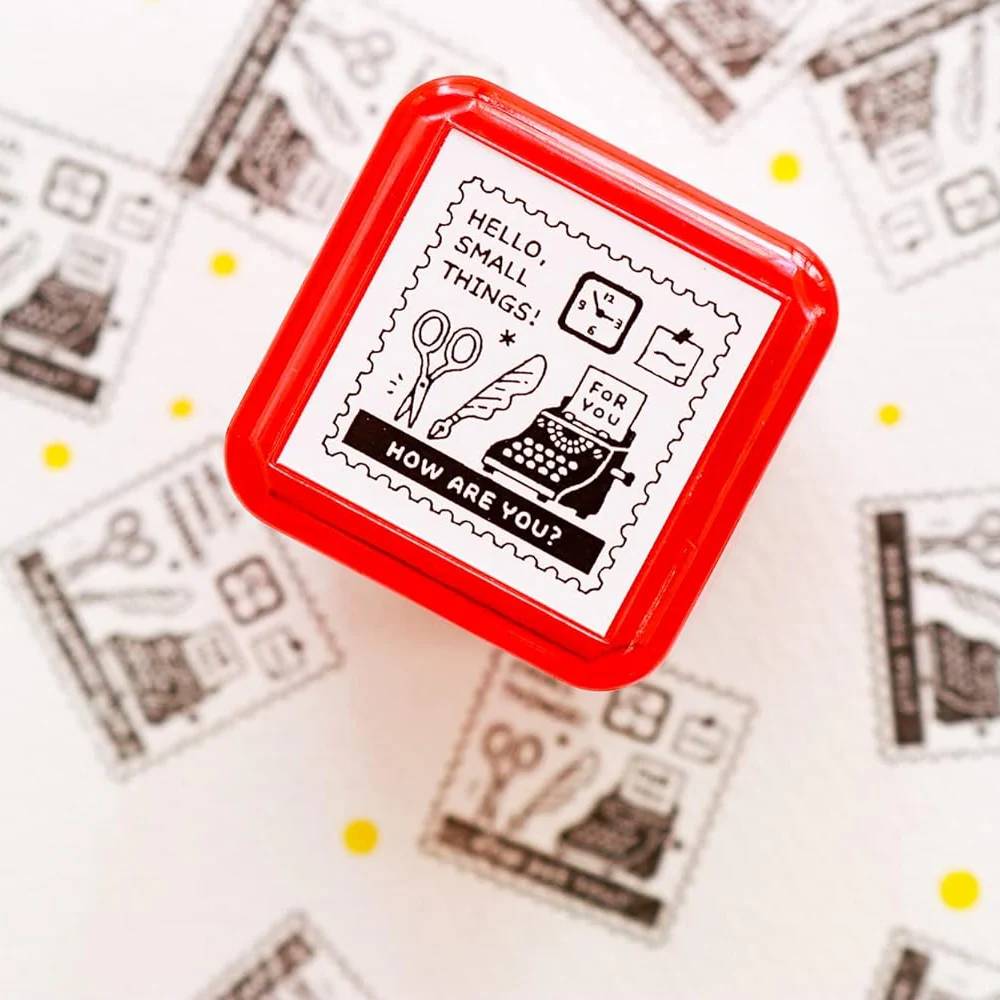 Eric Small Things Pre-Inked Stamp - Postage Stamp featuring a small square postal-themed design by Sanby Japan, displayed with its compact PET casing.