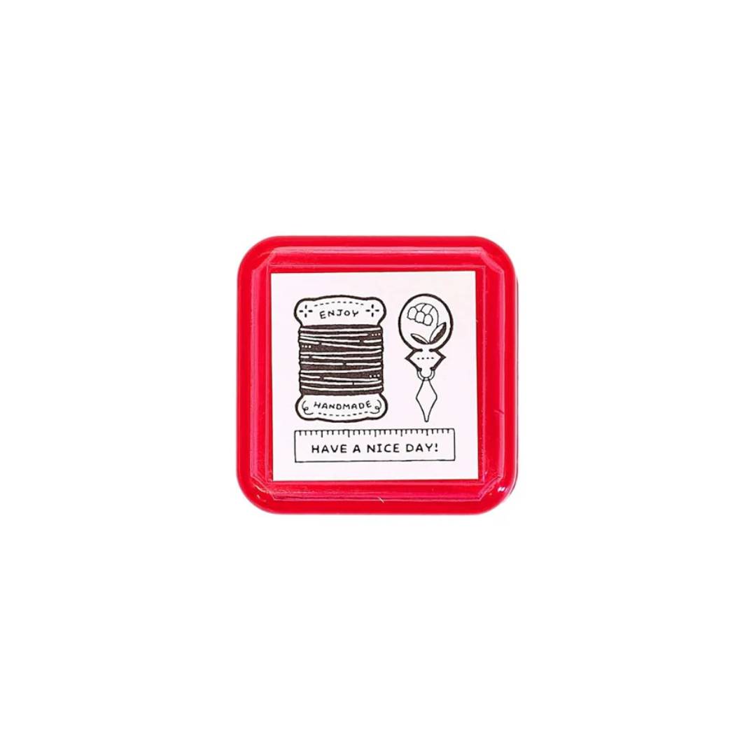 Eric Small Things Pre-Inked Stamp – Sewing Kit by Sanby Japan, compact black-ink stamp for journaling and planner decoration.