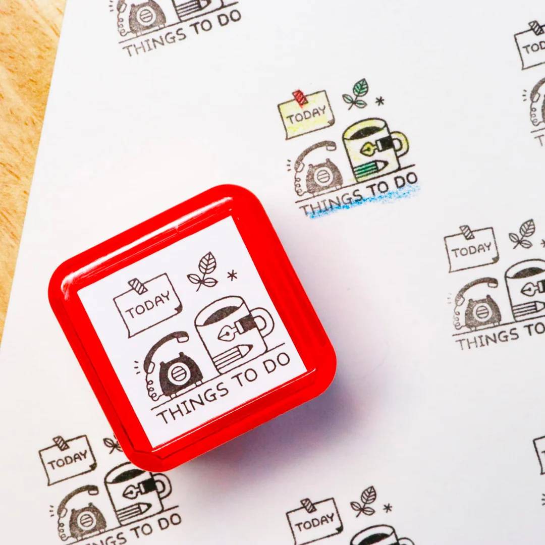 Sanby x Eric Small Things Pre-Inked Stamp – Things To Do, compact Japanese planner stamp with black ink.