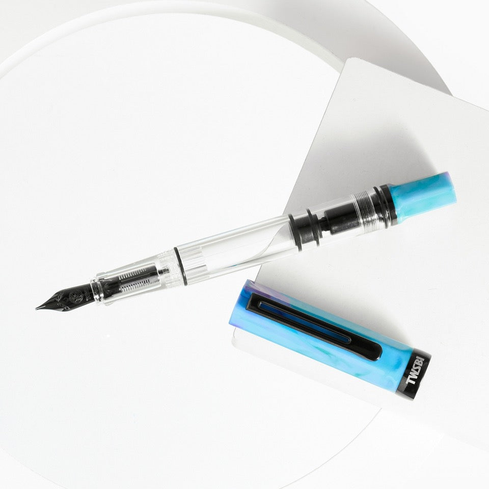 TWSBI ECO Fountain Pen Blue with Onyx cap and accents, transparent barrel, piston filler design.