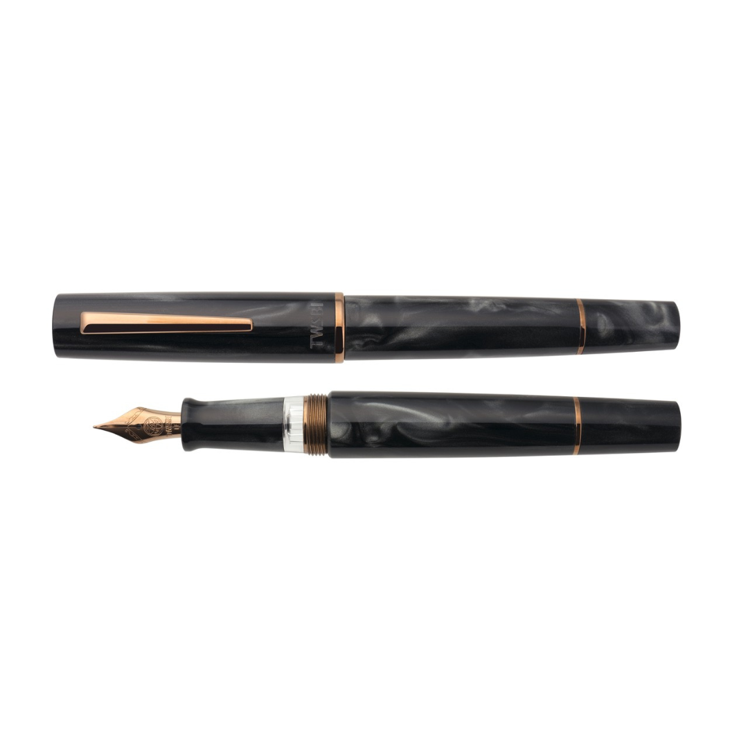 TWSBI Obsidian Fountain Pen — uncapped with cap posted