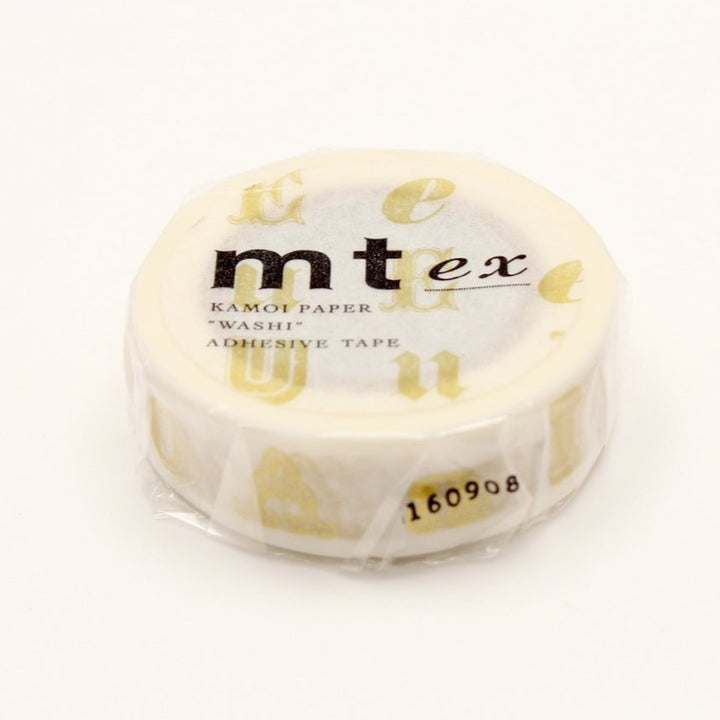 MT EX Washi Tape - Vowel Gold — applied on surface