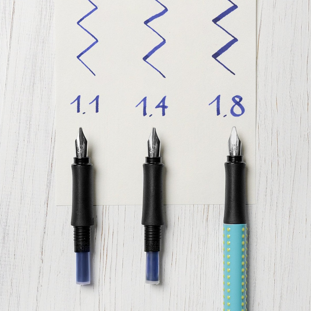 Faber-Castell Grip 2011 Fountain Pen Calligraphy Set Silver — in use