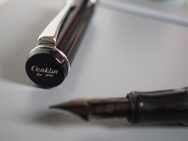 Conklin Duraflex Limited Edition Fountain Pen (Flex Nib) Chrome — writing at an angle