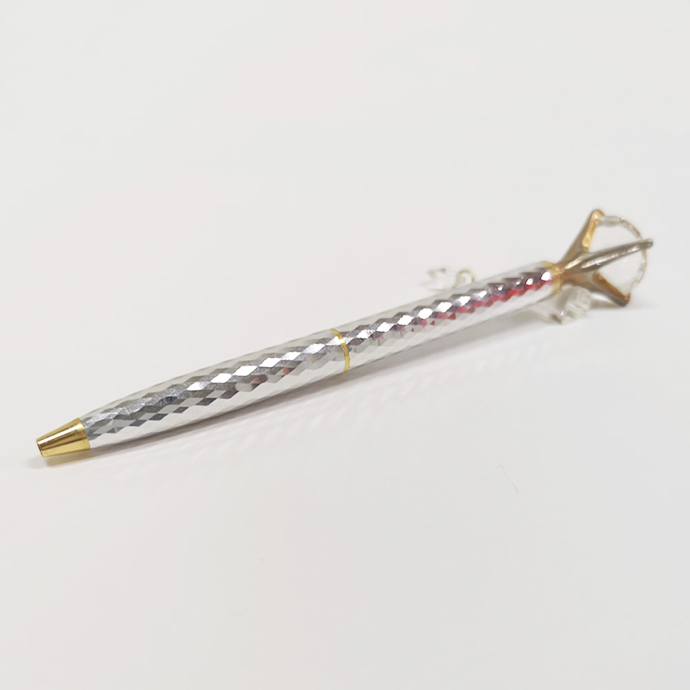 Helen Kelly Diamond Charm Pen Silver — writing at an angle