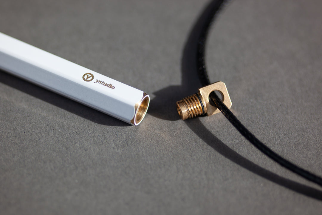 Ystudio Brassing Portable Ballpoint Pen White — writing at an angle