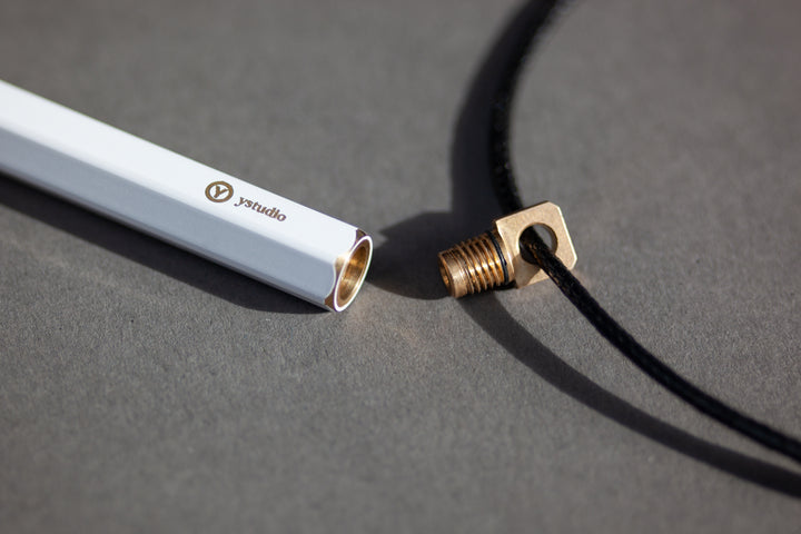 Ystudio Brassing Portable Ballpoint Pen White — writing at an angle