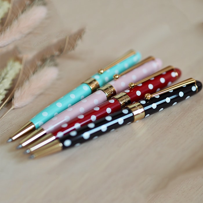 Helen Kelly Dotti Pen Black — writing at an angle