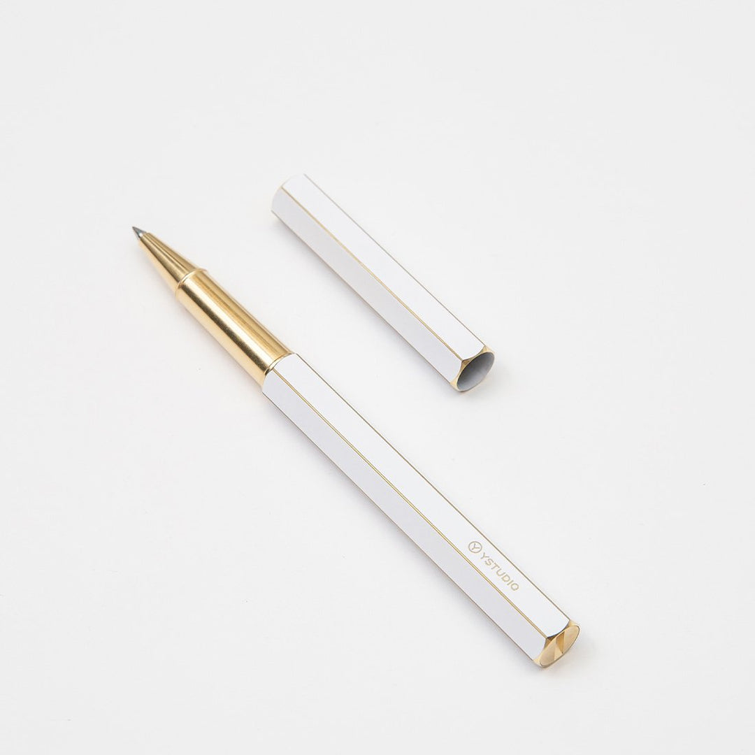 Ystudio Classic Revolve Rollerball Pen - White — flat lay