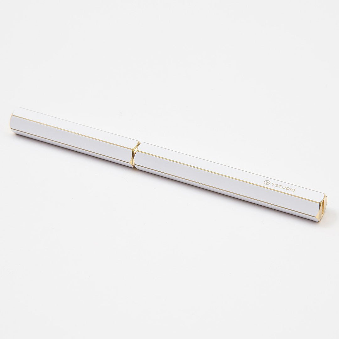 Ystudio Classic Revolve Rollerball Pen - White — flat lay