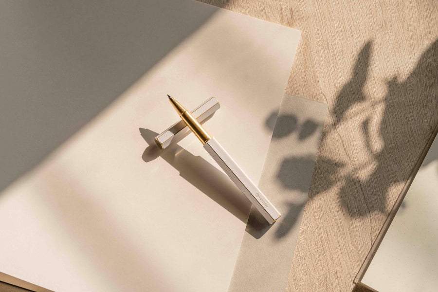 Ystudio Classic Revolve Rollerball Pen - White — flat lay