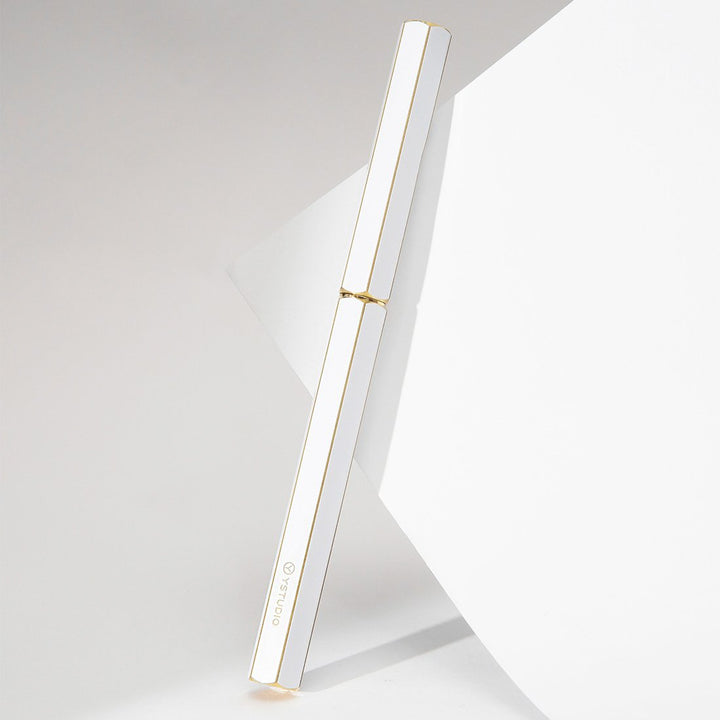 Ystudio Classic Revolve Rollerball Pen - White — flat lay