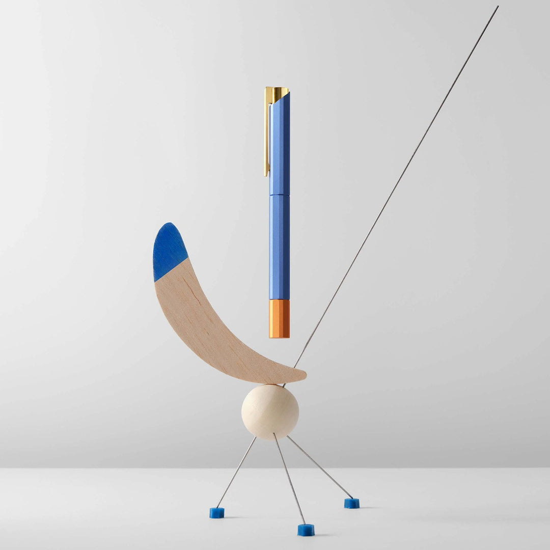 Ystudio Glamour Evolve-Bihex Rollerball Pen Blue Gin — writing at an angle
