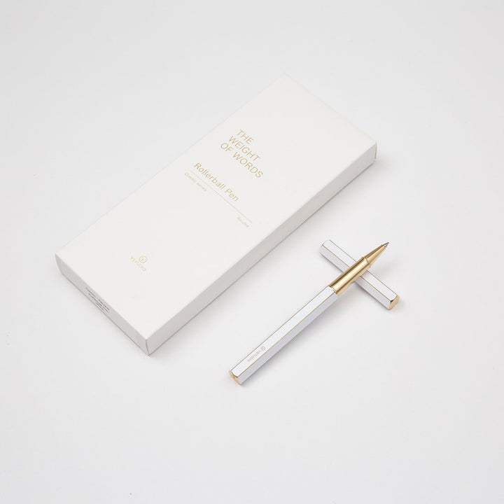 Ystudio Classic Revolve Rollerball Pen - White — flat lay