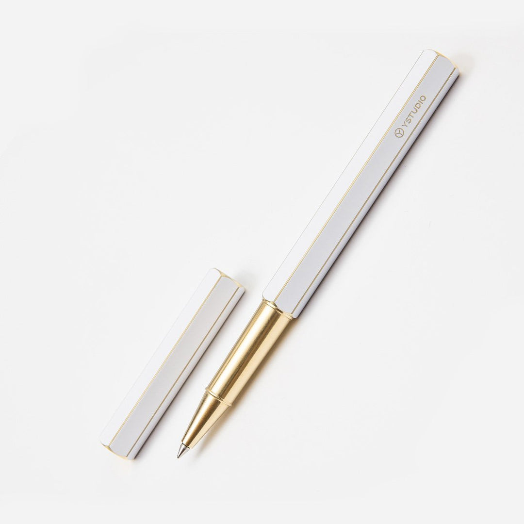 Ystudio Classic Revolve Rollerball Pen - White — flat lay