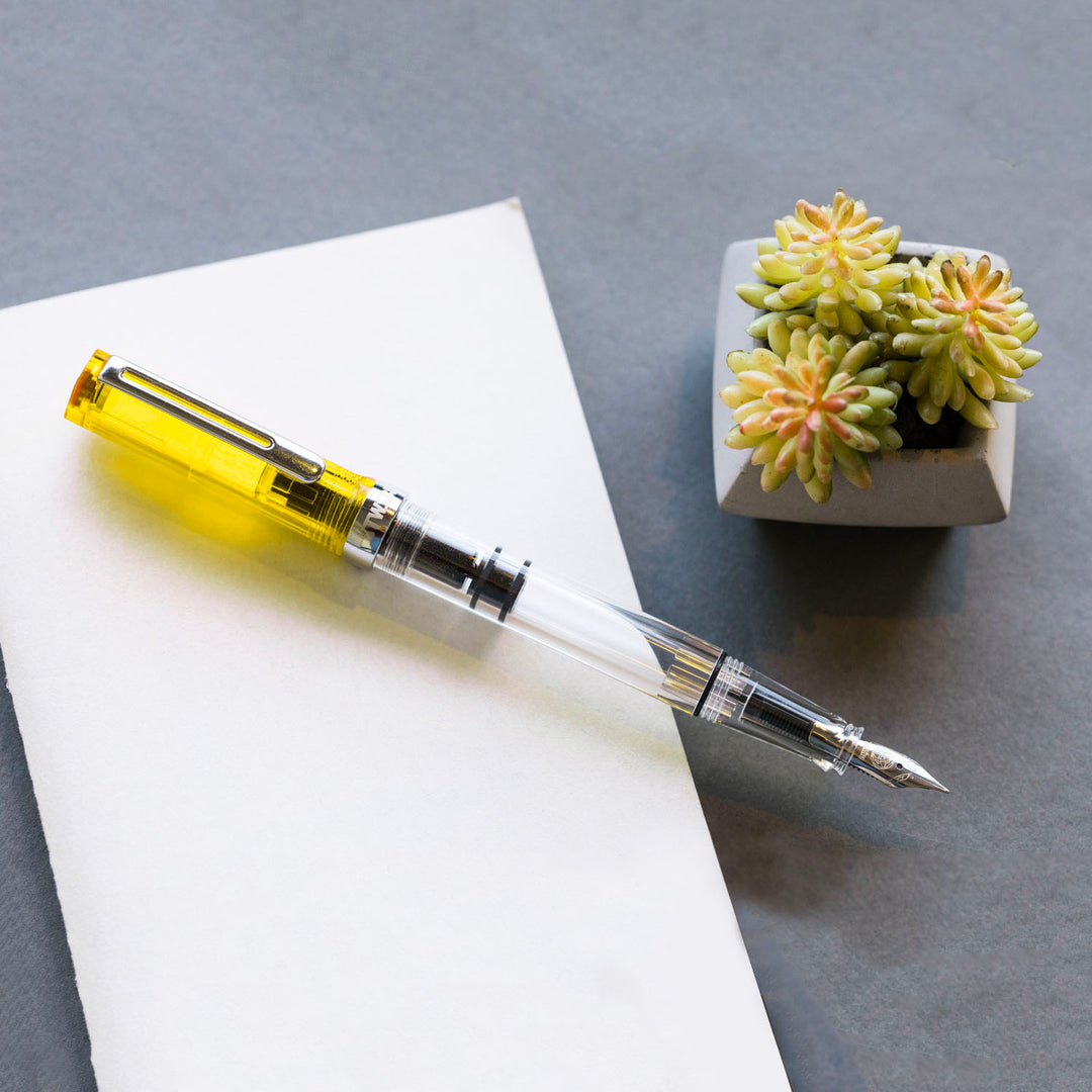 TWSBI ECO Fountain Pen Transparent Yellow — flat lay